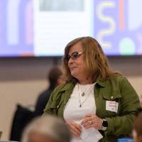 person standing and talking photo 4